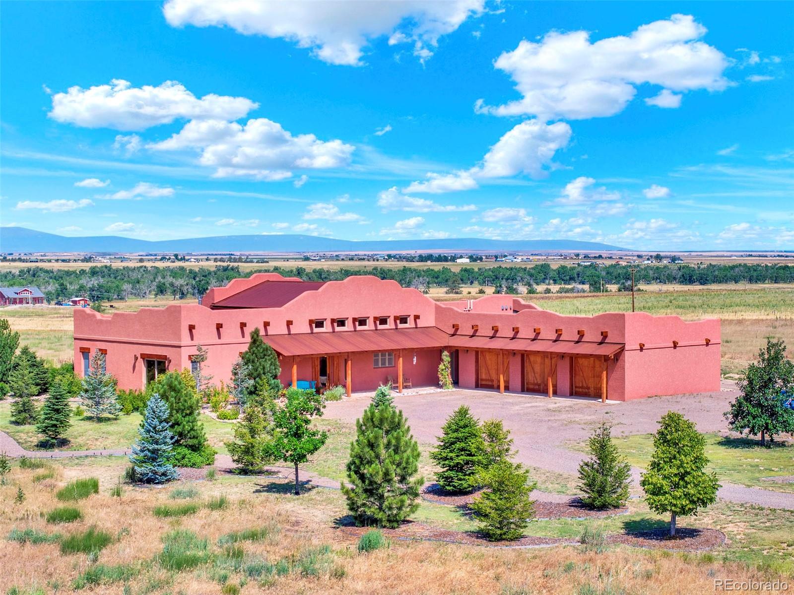 a front view of a multi story building with yard
