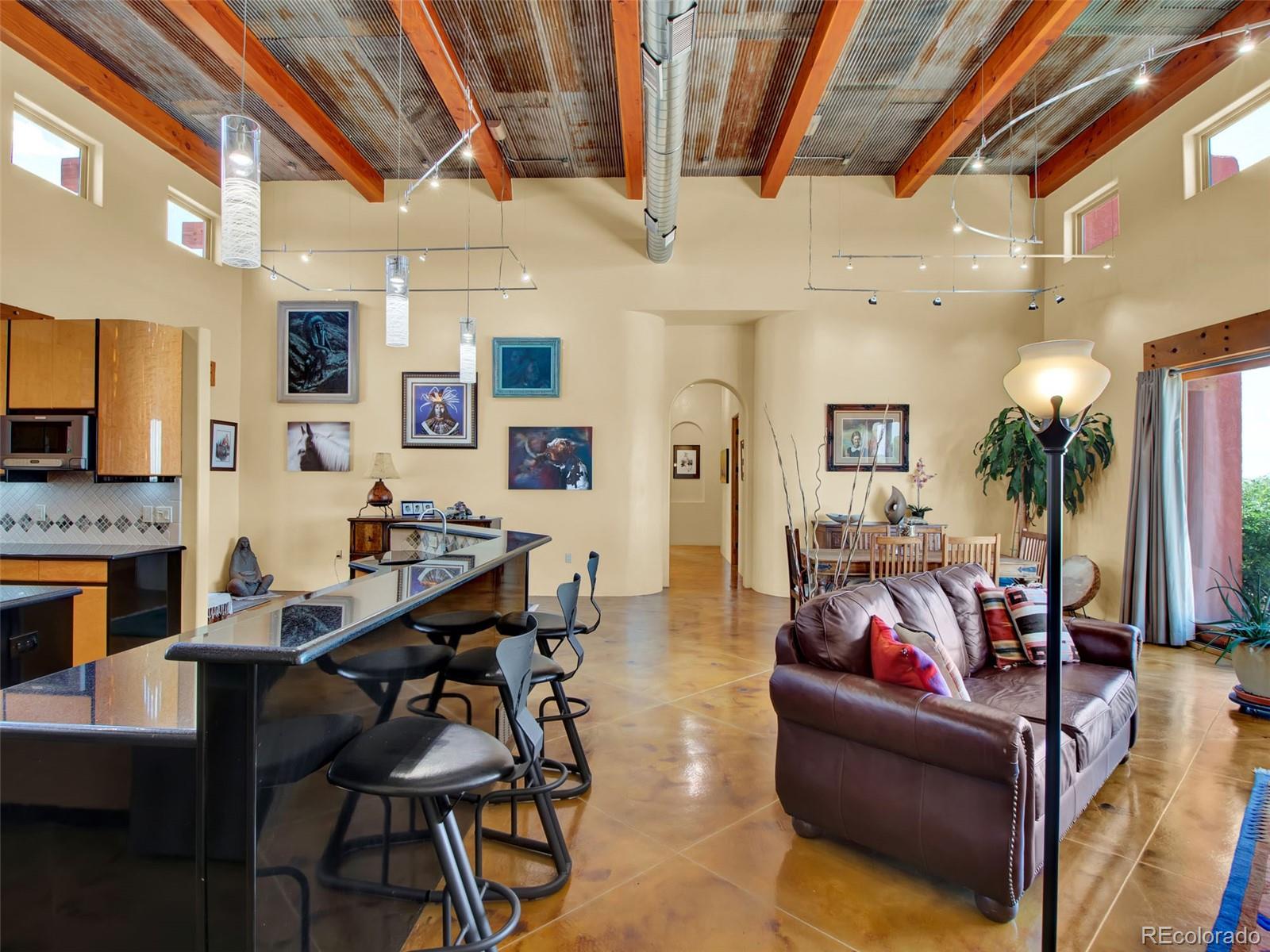 5549 Yulle Road Bennett, CO 80102 - Photo 21 of 47 a living room with furniture and a fireplace