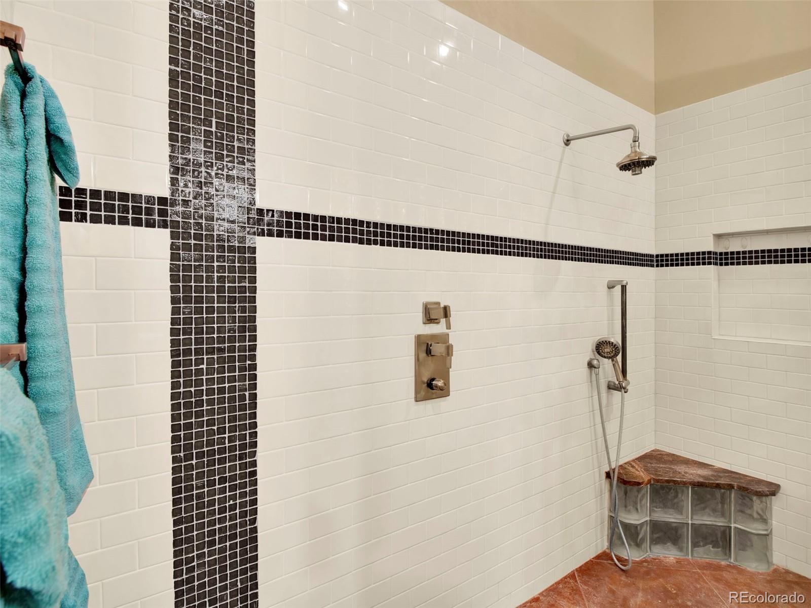 5549 Yulle Road Bennett, CO 80102 - Photo 32 of 47 a bathroom with a shower