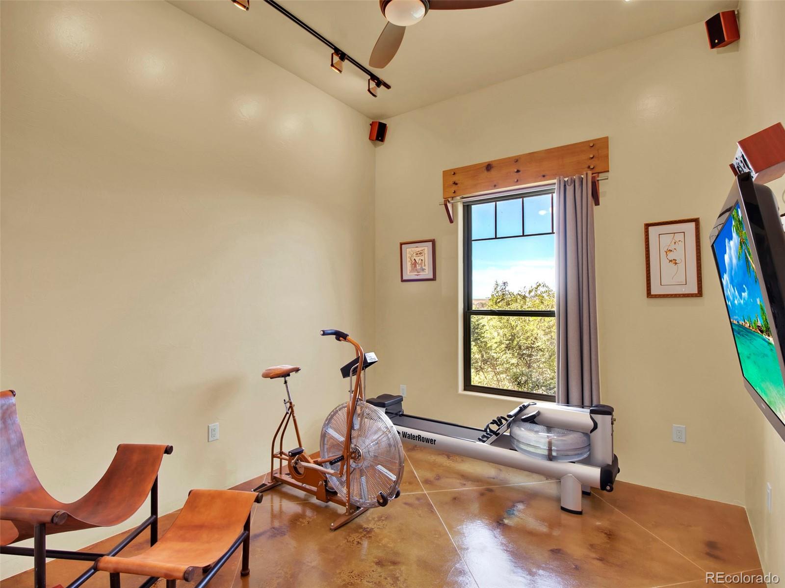5549 Yulle Road Bennett, CO 80102 - Photo 40 of 47 a living room with furniture a air conditioner vent and a window