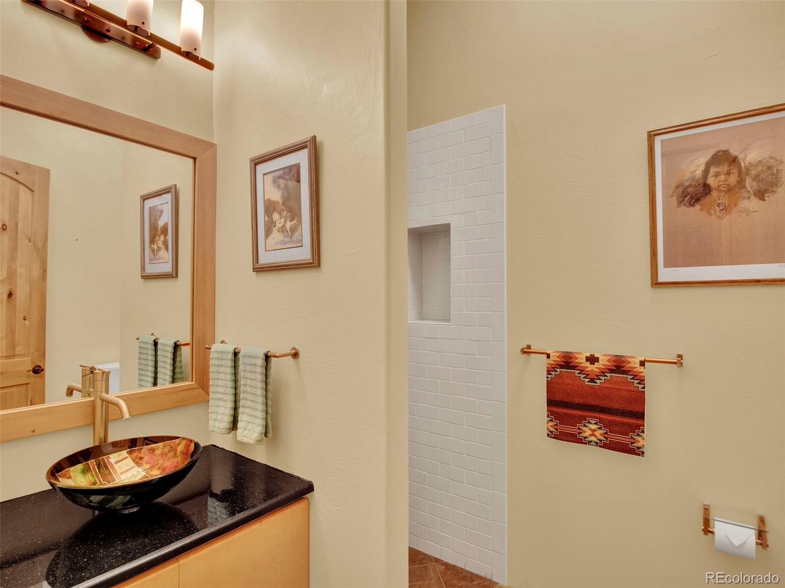 5549 Yulle Road Bennett, CO 80102 - Photo 41 of 47 a living room with furniture and a potted plant