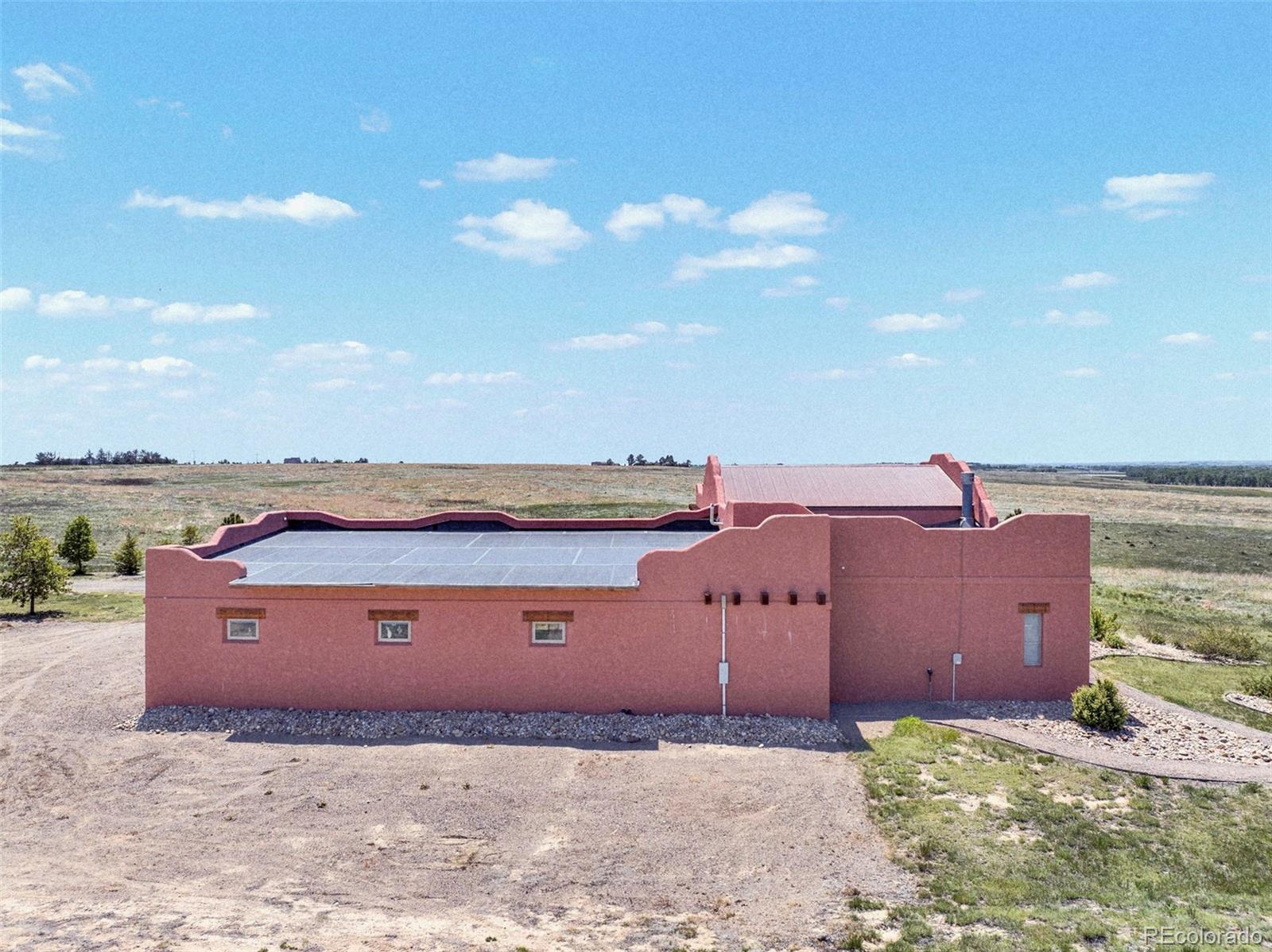 5549 Yulle Road Bennett, CO 80102 - Photo 6 of 47 front view of a house with a yard