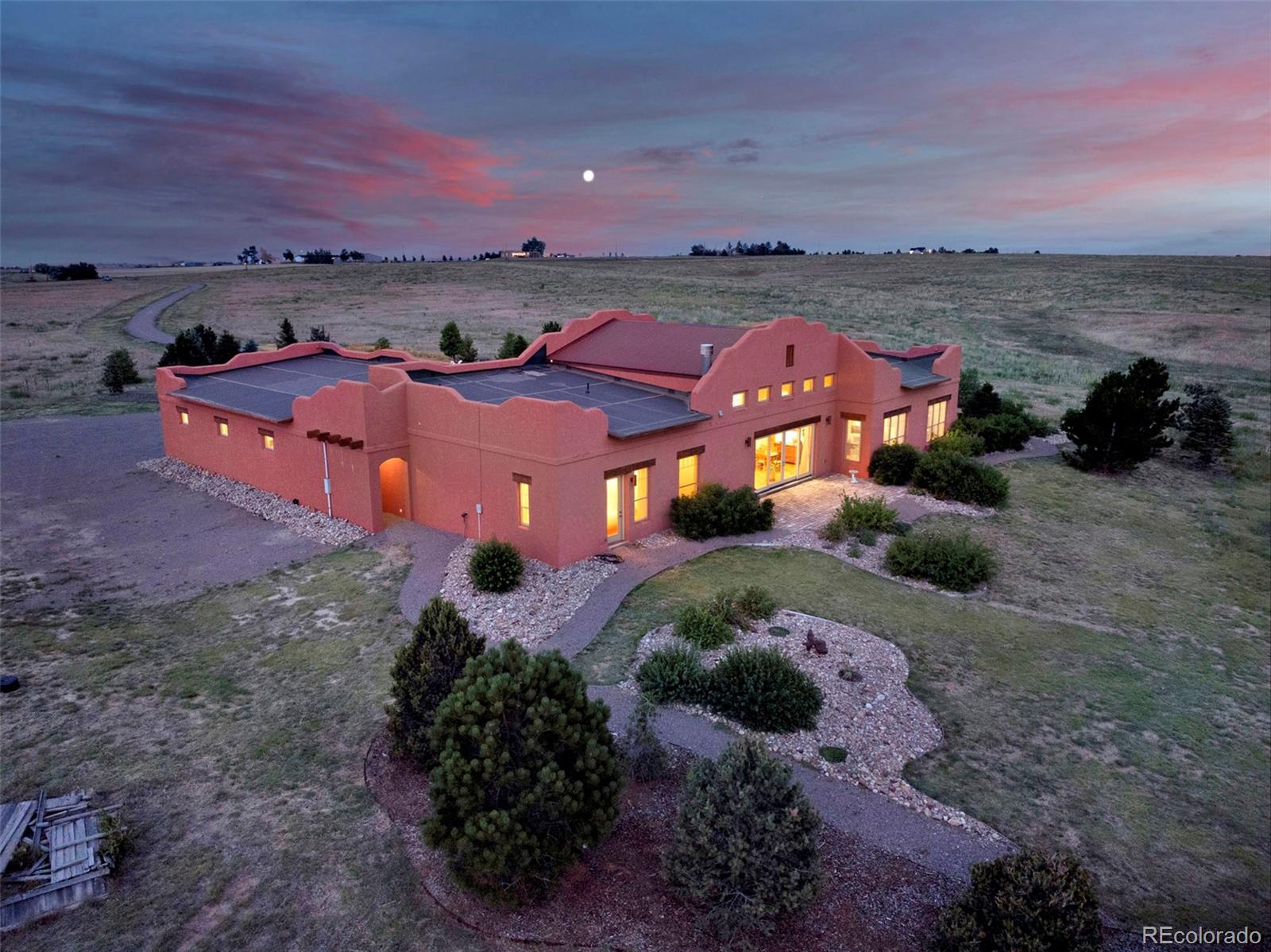 5549 Yulle Road Bennett, CO 80102 - Photo 10 of 47 an aerial view of a house with a garden and mountain view in back