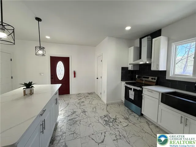 a kitchen with a sink stove and microwave