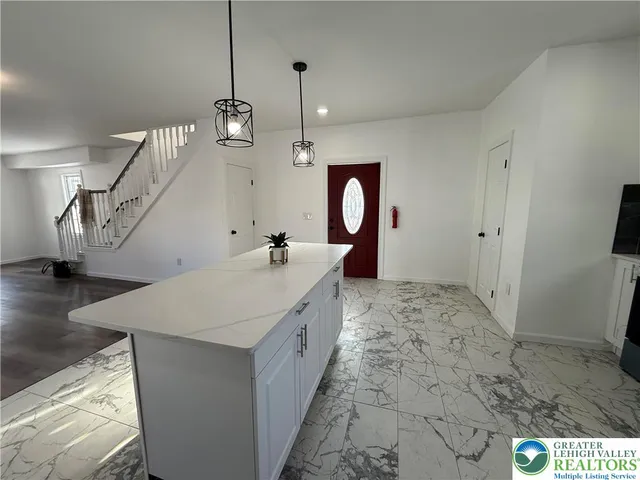 a bathroom with a sink a mirror and vanity