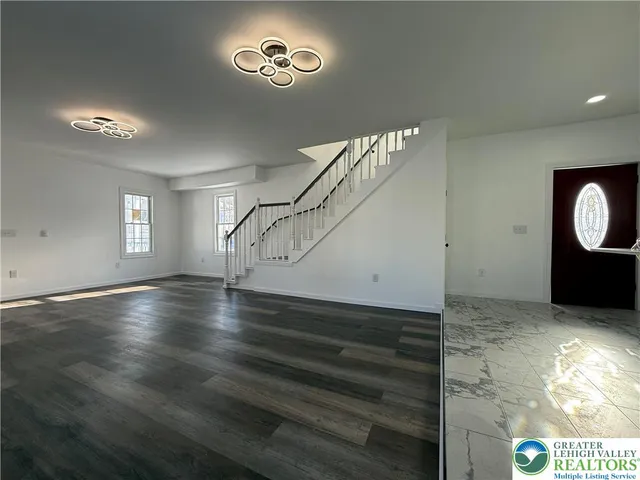 a view of a livingroom with wooden floor