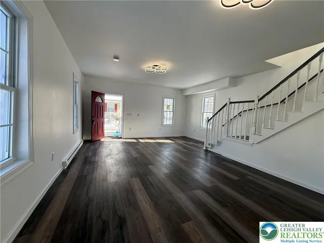 a view of entryway with wooden floor