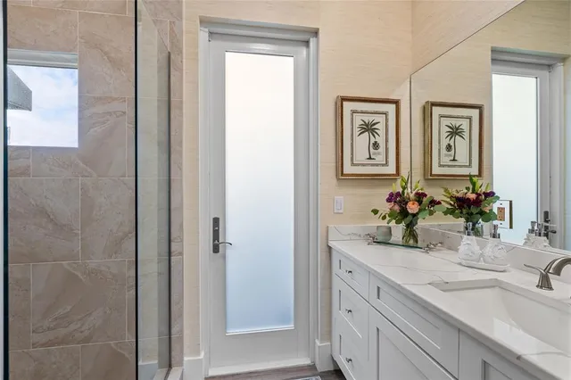 a bathroom with a sink and a mirror