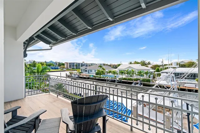 a view of a chairs and table in the balcony