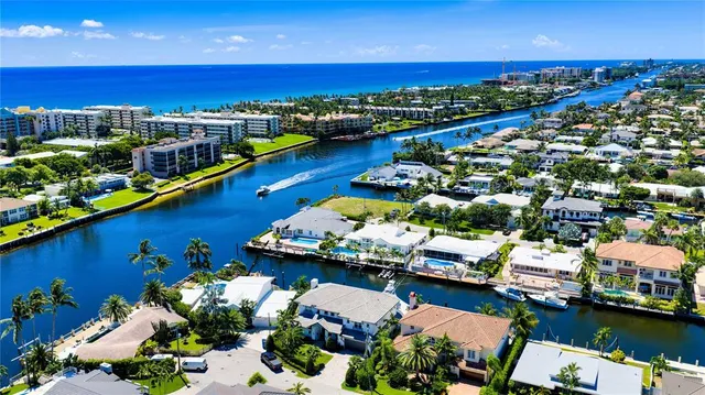 an aerial view of a house with a ocean view