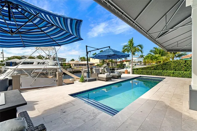 a view of a swimming pool with a patio