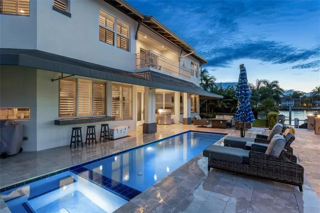 a living room with furniture a fireplace and a table