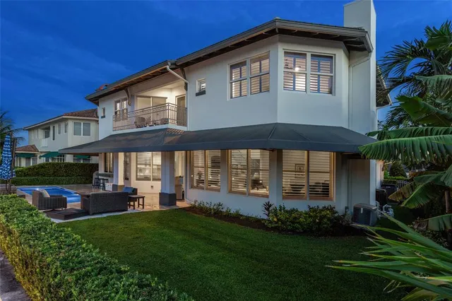 a front view of a house with a yard table and chairs