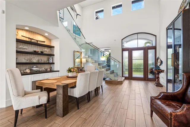 a view of a livingroom with furniture window and wooden floor