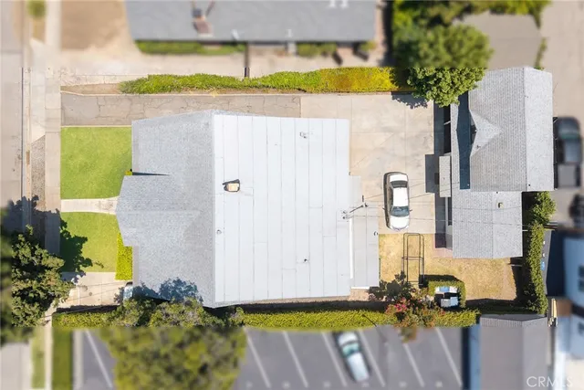 an aerial view of a house with a swimming pool