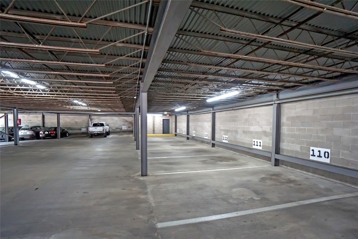 1212 Guadalupe Street, Unit 1004 Austin, TX 78701 - Photo 32 of 33 Parking garage with concrete block wall