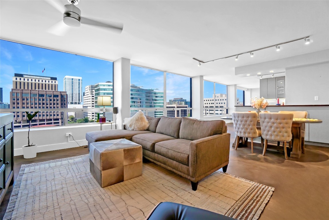 1212 Guadalupe Street, Unit 1004 Austin, TX 78701 - Photo 5 of 33 Living room with a view of city, track lighting, and concrete flooring