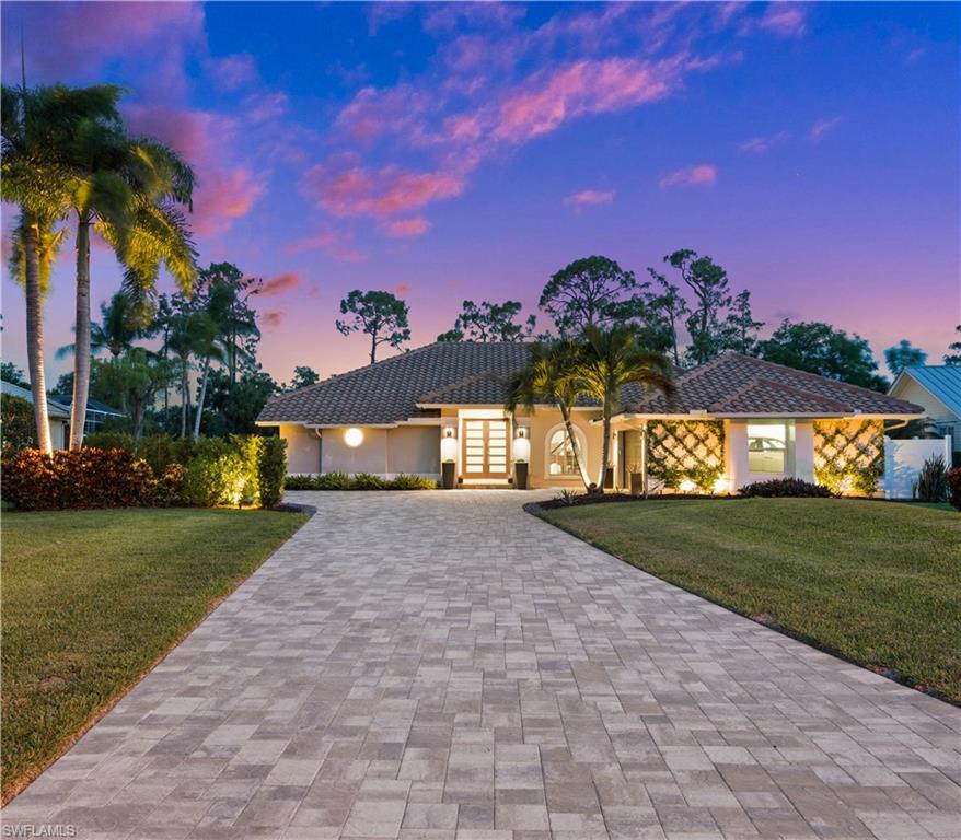 a view of a house with a yard