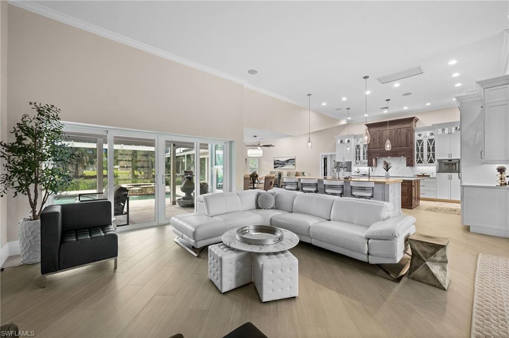 2022 Duke Drive Naples, FL 34110 - Photo 11 of 40 a living room with furniture and a large window
