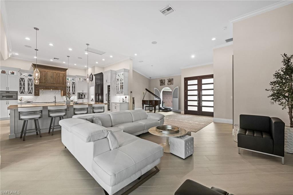 2022 Duke Drive Naples, FL 34110 - Photo 14 of 40 a living room with furniture and a large window