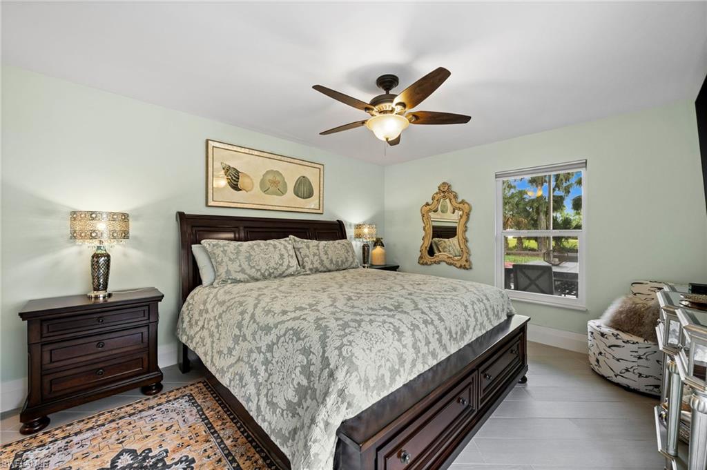 2022 Duke Drive Naples, FL 34110 - Photo 21 of 40 a bedroom with a bed and a window