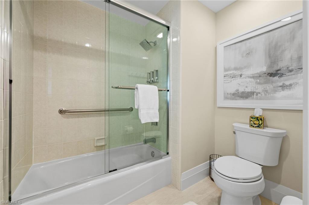 2022 Duke Drive Naples, FL 34110 - Photo 24 of 40 a bathroom with a toilet and a shower