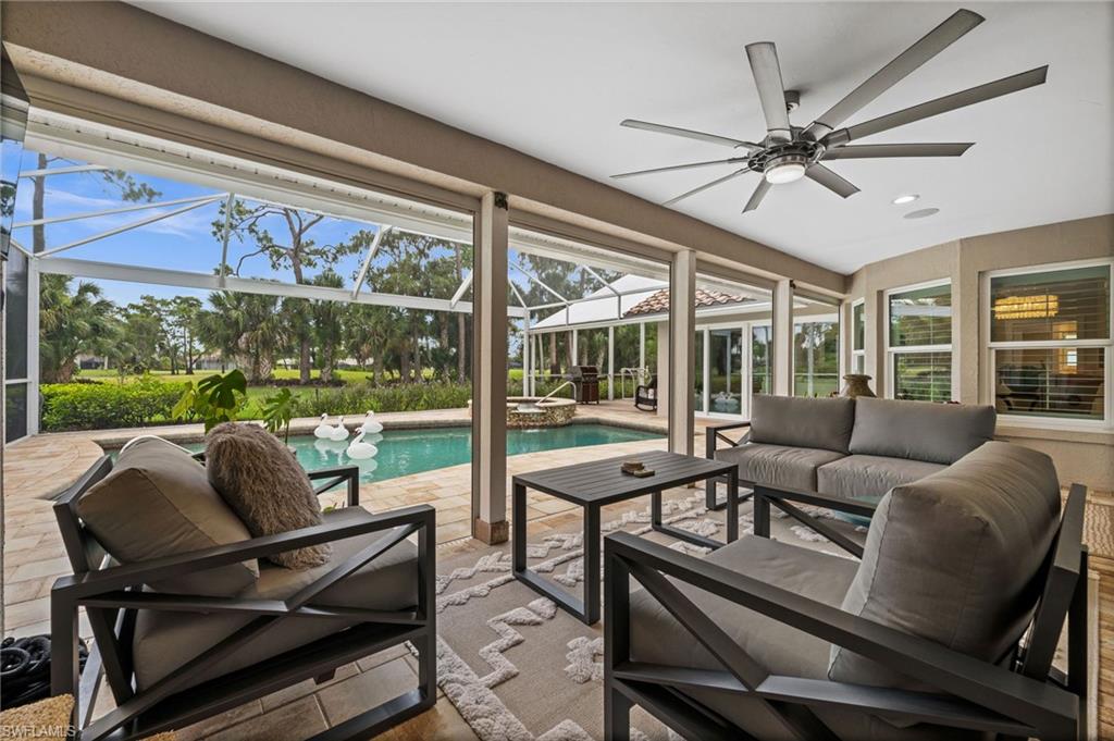 2022 Duke Drive Naples, FL 34110 - Photo 27 of 40 a living room with furniture and a large window