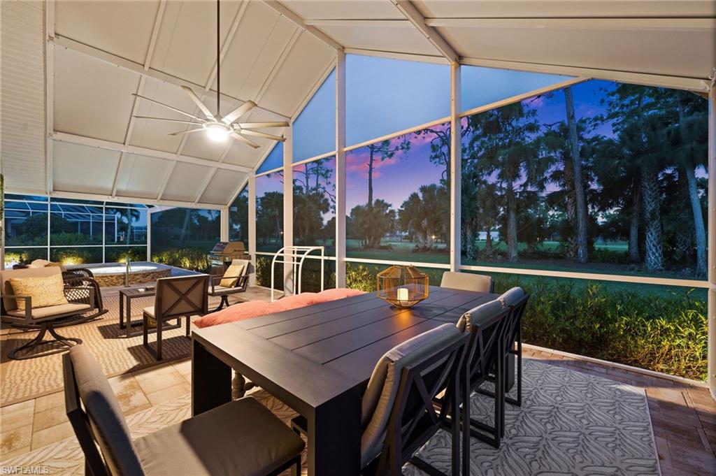 2022 Duke Drive Naples, FL 34110 - Photo 29 of 40 a view of a patio with a table and chairs