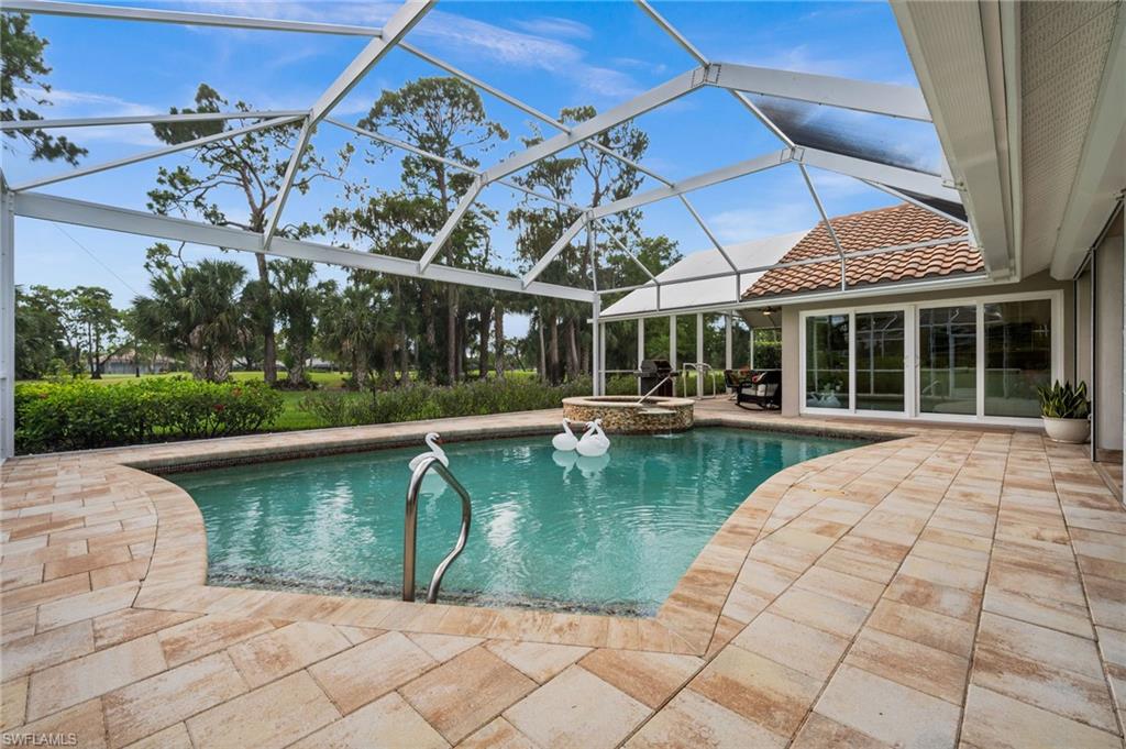 2022 Duke Drive Naples, FL 34110 - Photo 30 of 40 a view of a swimming pool with a patio