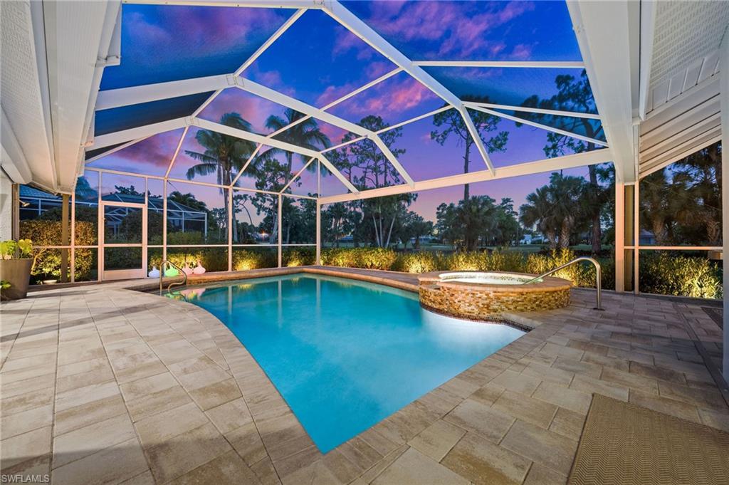 2022 Duke Drive Naples, FL 34110 - Photo 3 of 40 a view of a swimming pool with a patio