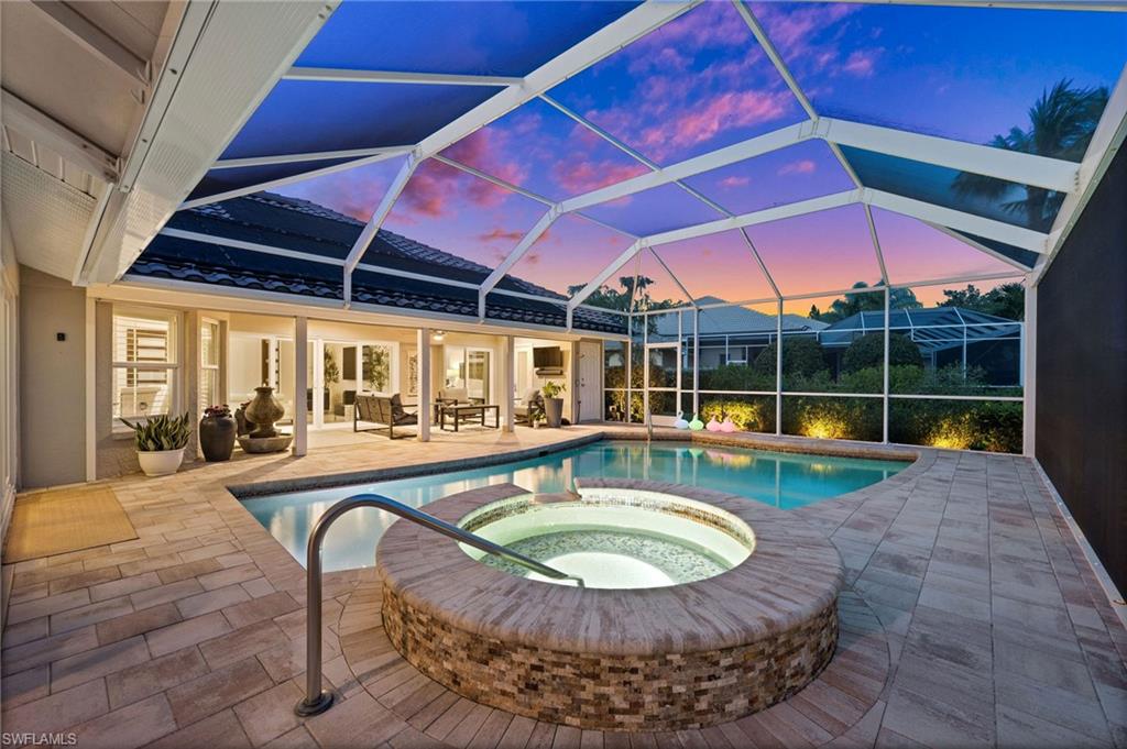 2022 Duke Drive Naples, FL 34110 - Photo 31 of 40 a view of a house with swimming pool and porch