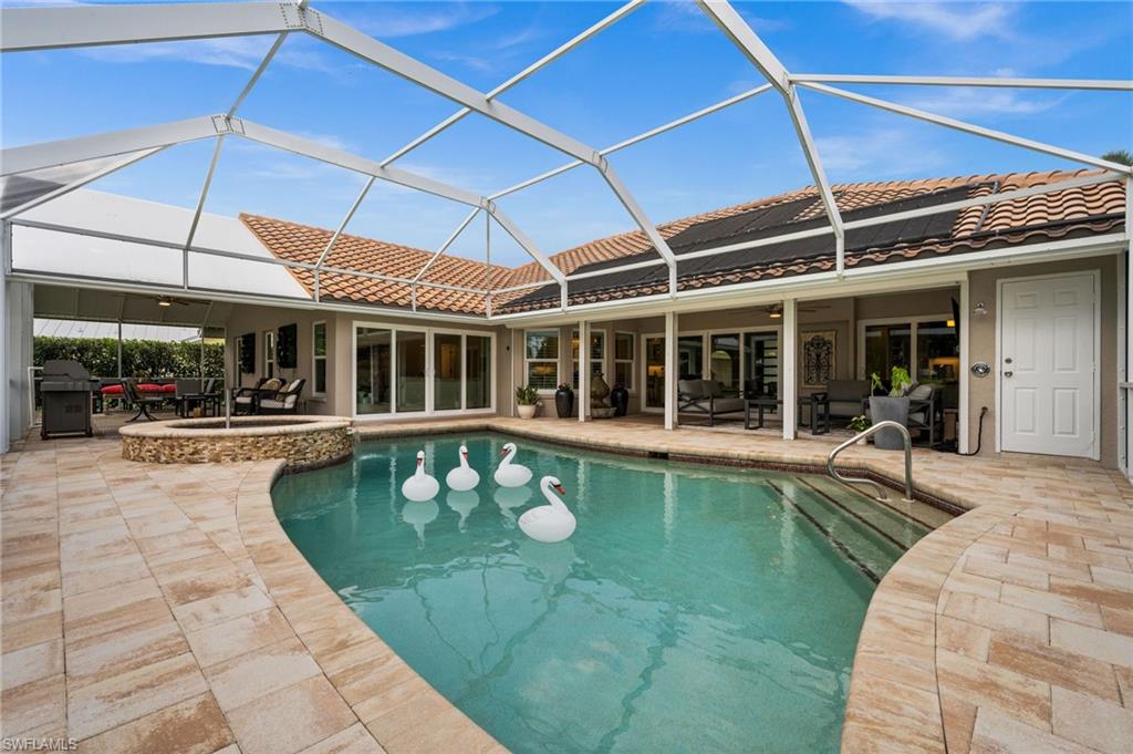 2022 Duke Drive Naples, FL 34110 - Photo 32 of 40 a view of a swimming pool with a patio