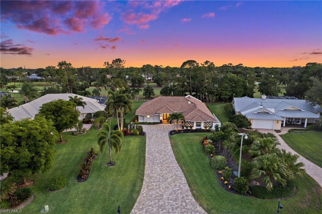 2022 Duke Drive Naples, FL 34110 - Photo 38 of 40 a view of houses with yard