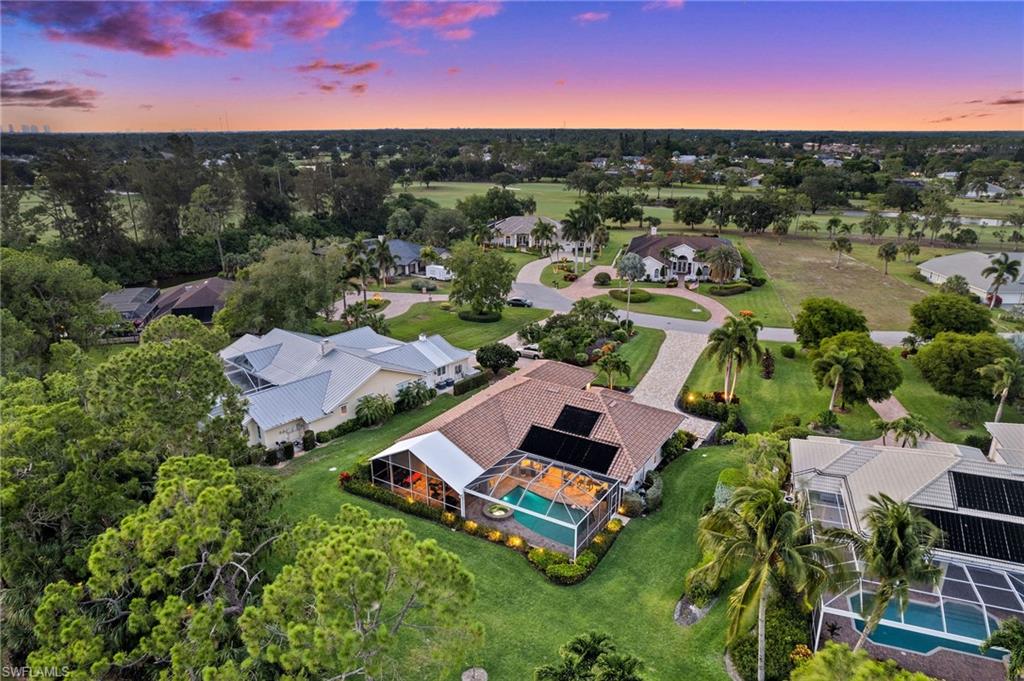 2022 Duke Drive Naples, FL 34110 - Photo 39 of 40 an aerial view of a house with a garden