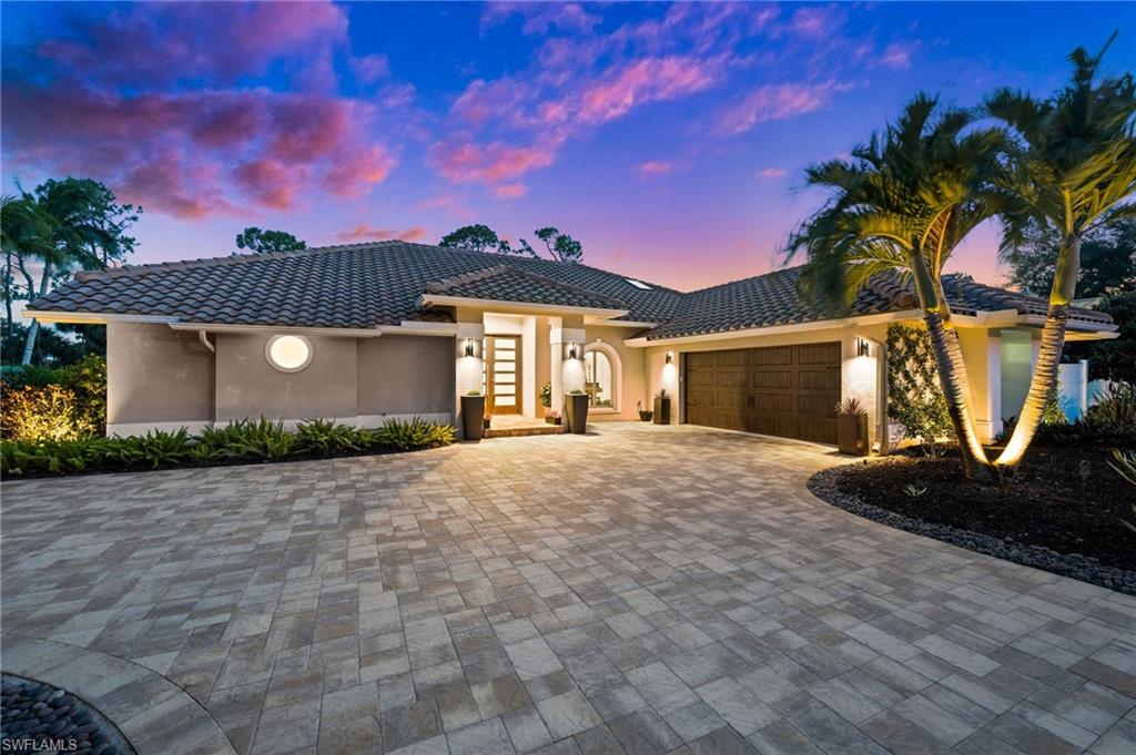 2022 Duke Drive Naples, FL 34110 - Photo 40 of 40 a front view of a house with garden