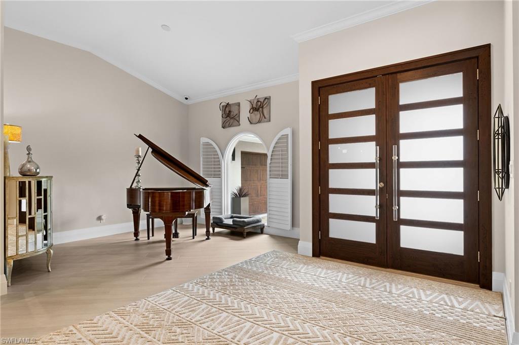 2022 Duke Drive Naples, FL 34110 - Photo 4 of 40 a view of a livingroom with furniture and staircase
