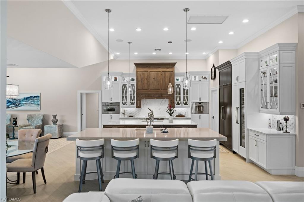 2022 Duke Drive Naples, FL 34110 - Photo 6 of 40 a large kitchen with a table and chairs