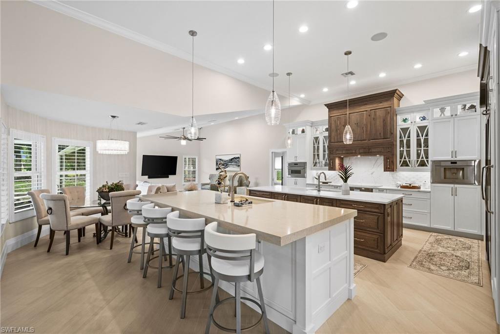 2022 Duke Drive Naples, FL 34110 - Photo 7 of 40 a large kitchen with a table and chairs