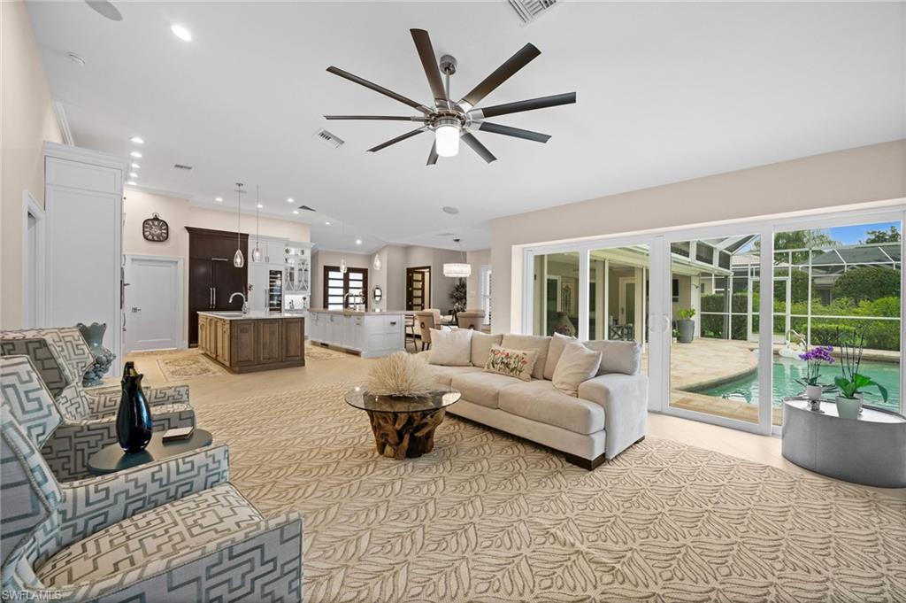2022 Duke Drive Naples, FL 34110 - Photo 10 of 40 a living room with furniture and a large window