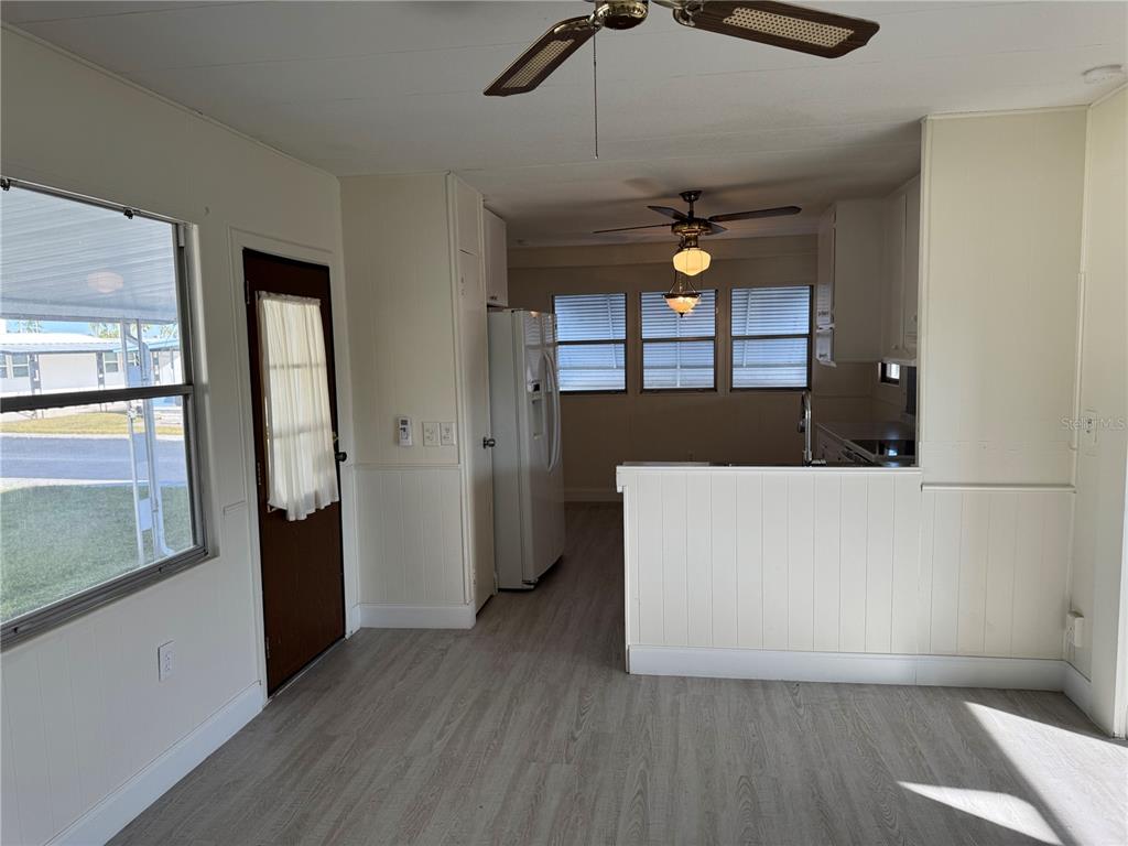 10805 Tioga Drive Port Richey, FL 34668 - Photo 4 of 15 a living room with a bed furniture and a large window