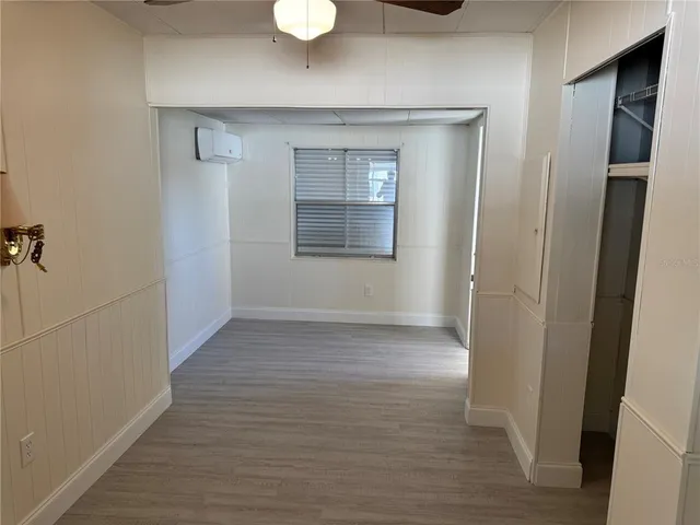 a view of a room with wooden floor and staircase