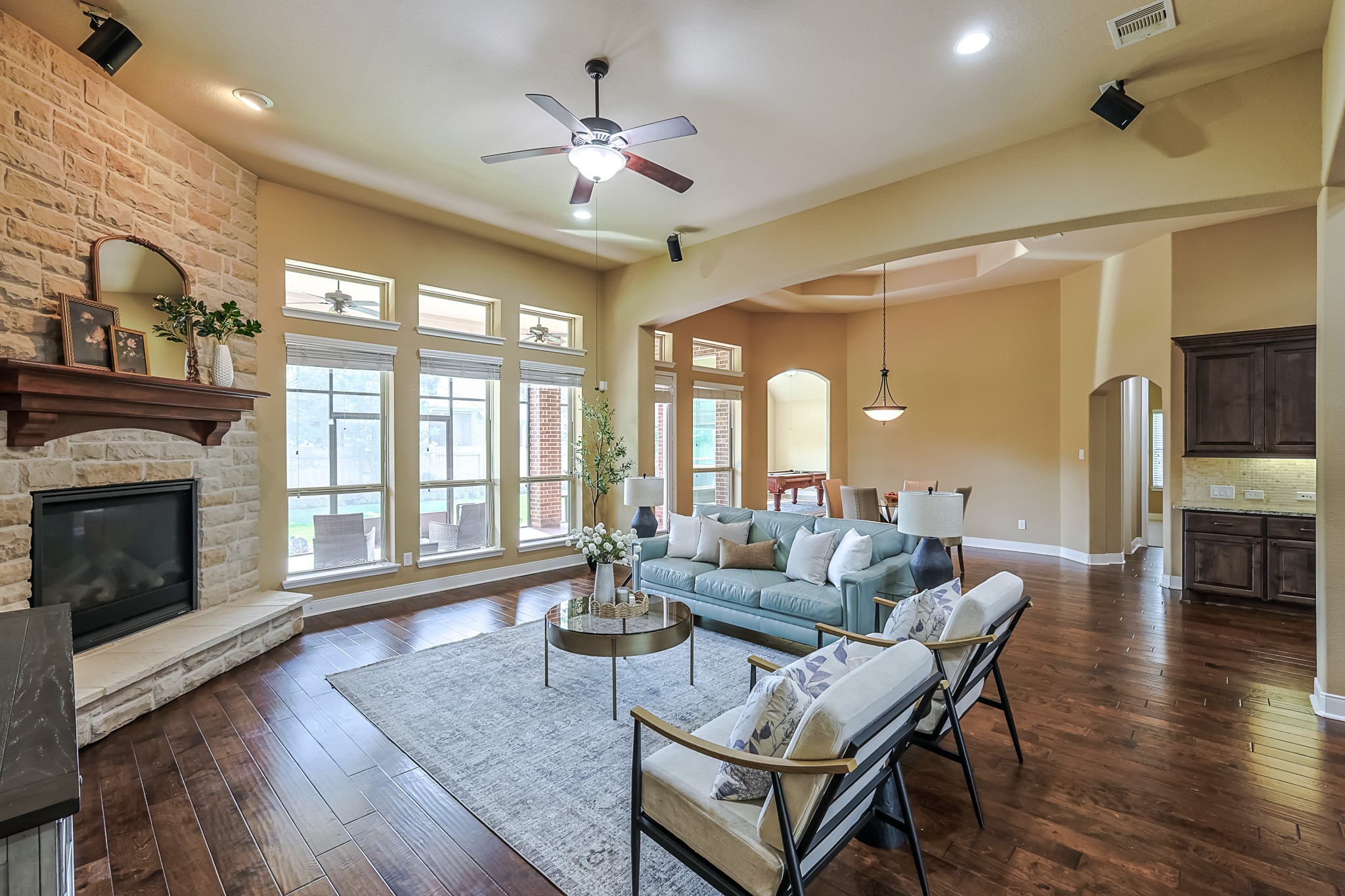 515 Mill Creek Road Pinehurst, TX 77362 - Photo 11 of 48 The open layout seamlessly connects to a dining area and kitchen, offering a perfect space for entertaining.