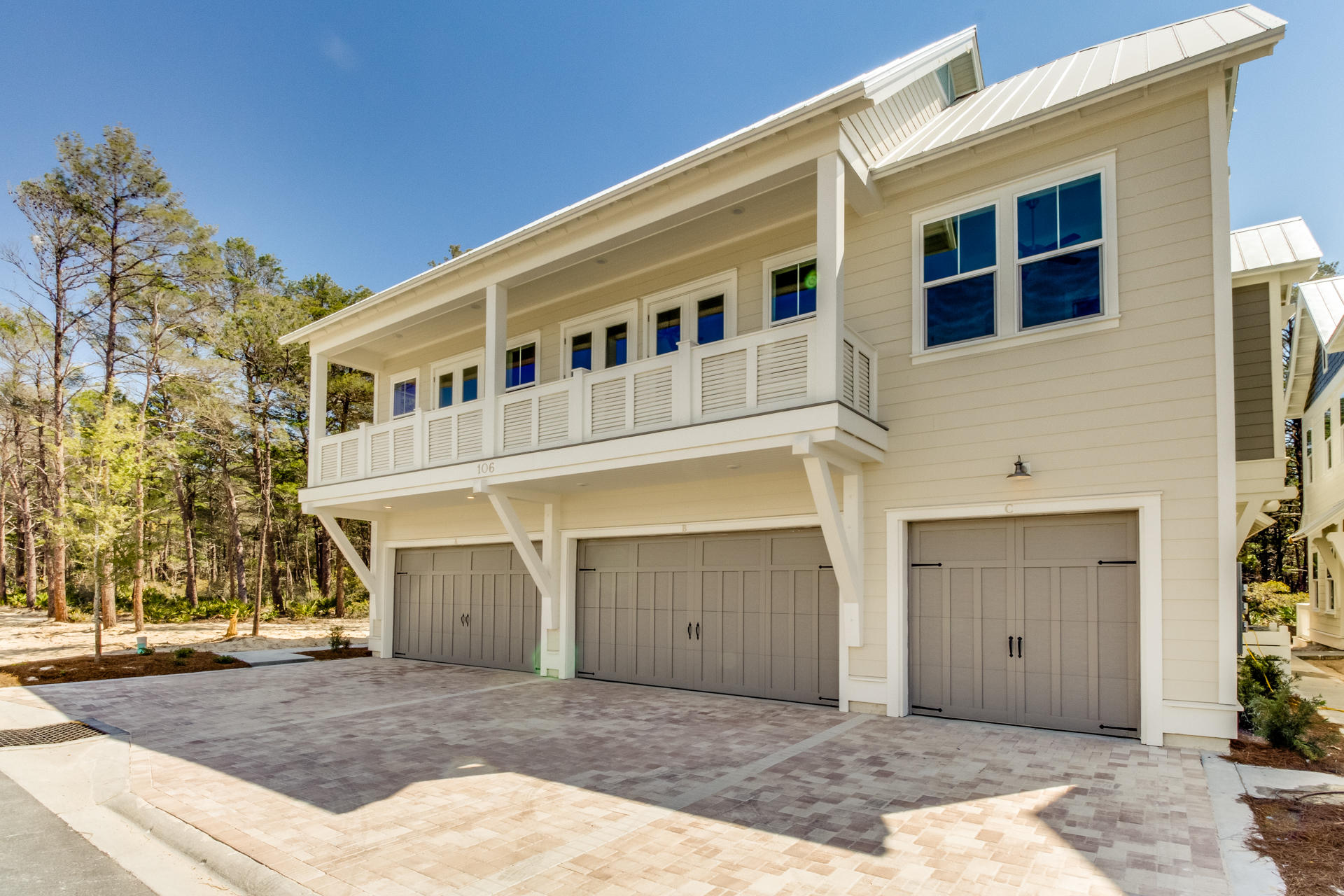 79 Pine Lands Loop Inlet Beach East, Unit C Inlet Beach, FL 32461 - Photo 1 of 20 a front view of a house with a yard