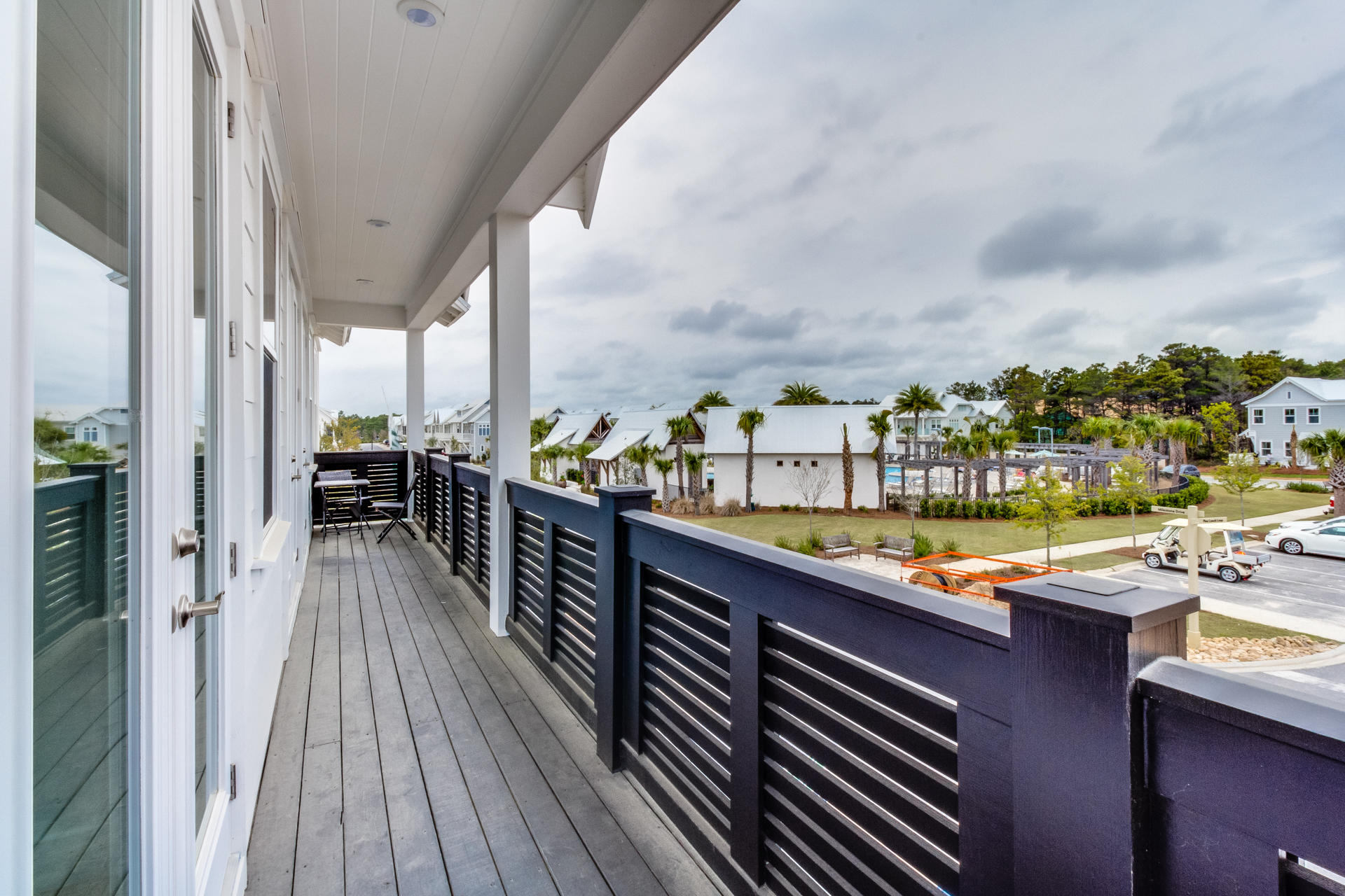 79 Pine Lands Loop Inlet Beach East, Unit C Inlet Beach, FL 32461 - Photo 5 of 20 a view of swimming pool from a balcony