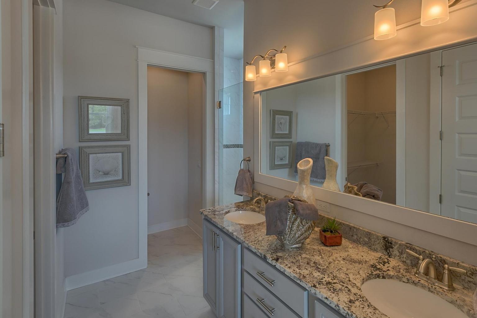 79 Pine Lands Loop Inlet Beach East, Unit C Inlet Beach, FL 32461 - Photo 9 of 20 a bathroom with a granite countertop sink and a mirror