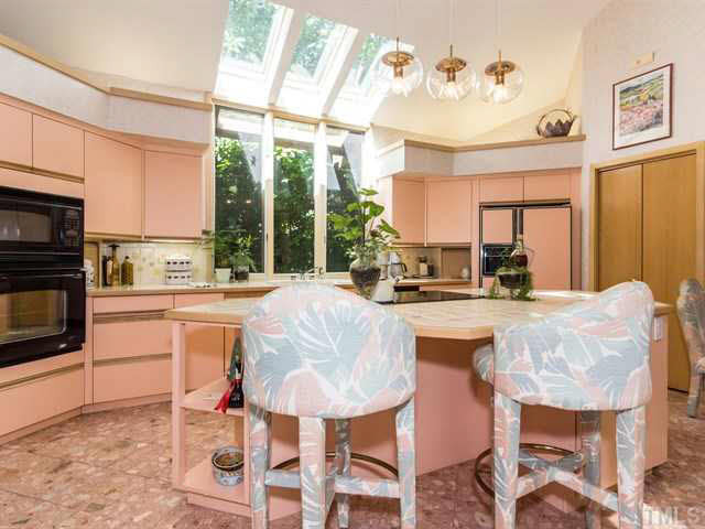 10000 Old Warden Road Raleigh, NC 27615 - Photo 14 of 25 Skylights & the window over the sink allow for natural light to filter into the kitchen. Kitchen