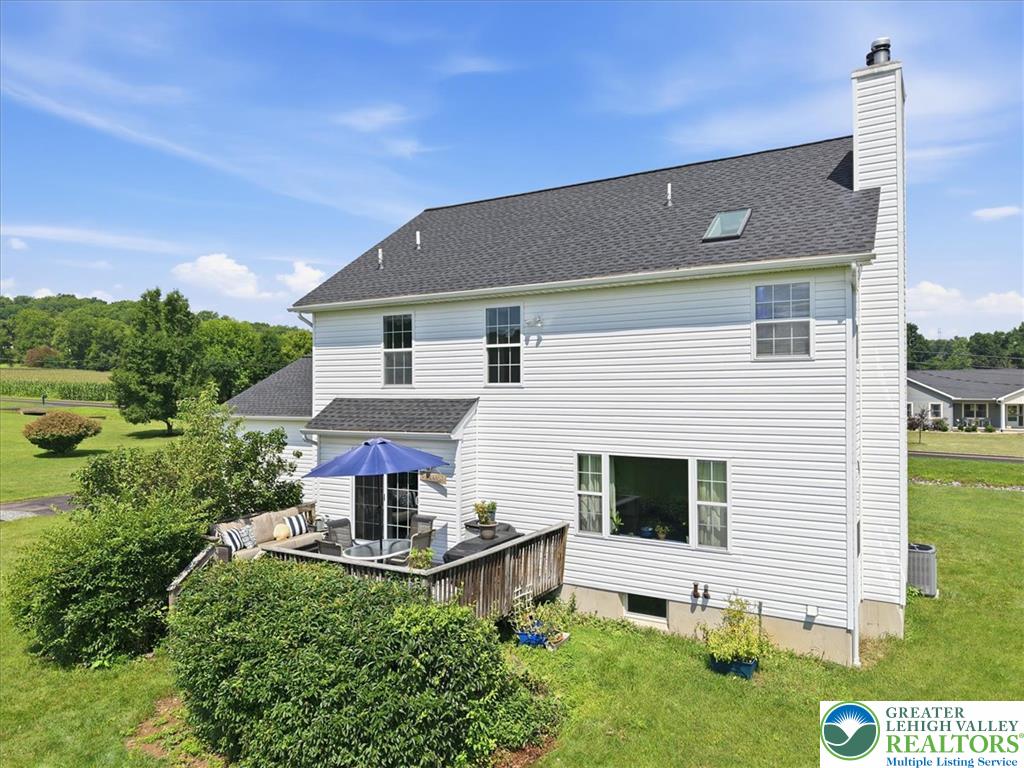 66 Labar Road Bangor, PA 18013 - Photo 46 of 56 A private deck with ample seating extends from the home, offering serene backyard views.