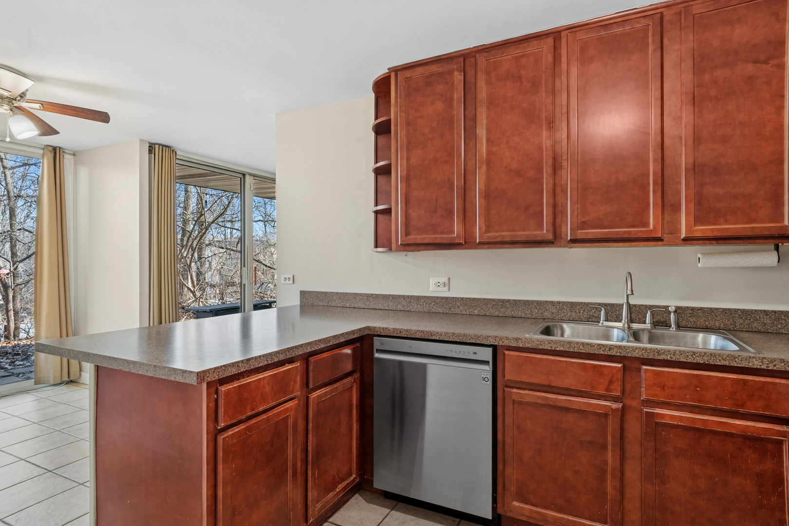 6012 Forest View Road, Unit 1D Lisle, IL 60532 - Photo 12 of 21 a kitchen with stainless steel appliances granite countertop wooden cabinets a sink and dishwasher