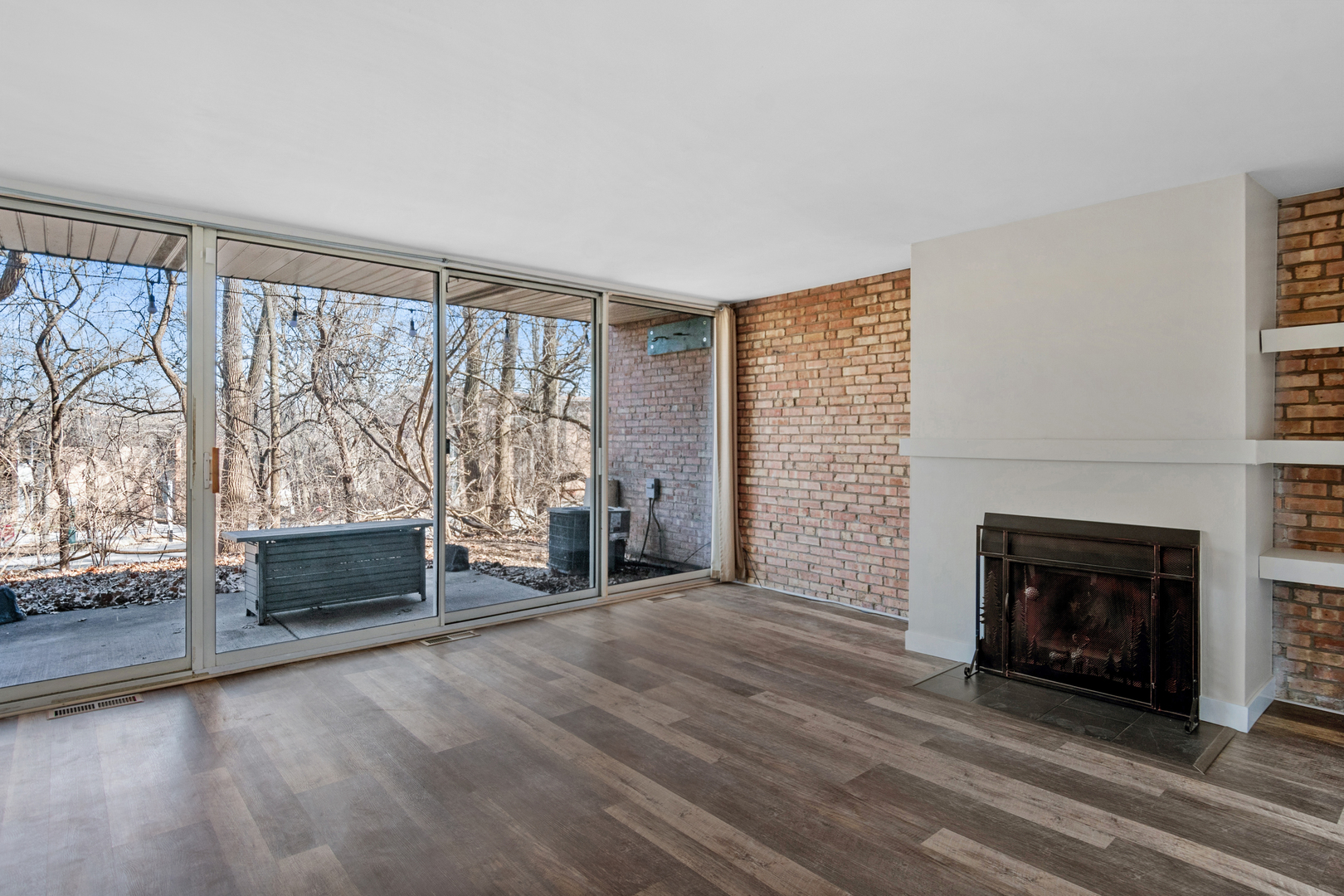 6012 Forest View Road, Unit 1D Lisle, IL 60532 - Photo 15 of 21 an empty room with furniture and a fireplace