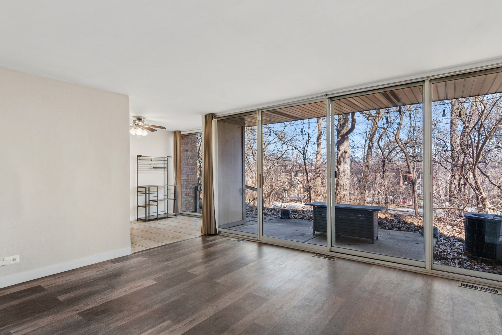 6012 Forest View Road, Unit 1D Lisle, IL 60532 - Photo 16 of 21 wooden floor in an empty room with a fireplace